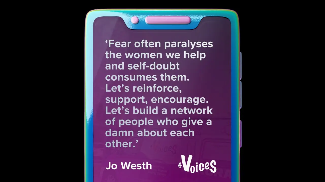 A phone shows a quote from Jo Westh of 4Voices, 'Fear often paralyses the women we help and self-doubt consumes them. Let’s reinforce, support, encourage. Let’s build a network of people who give a damn about each other.'